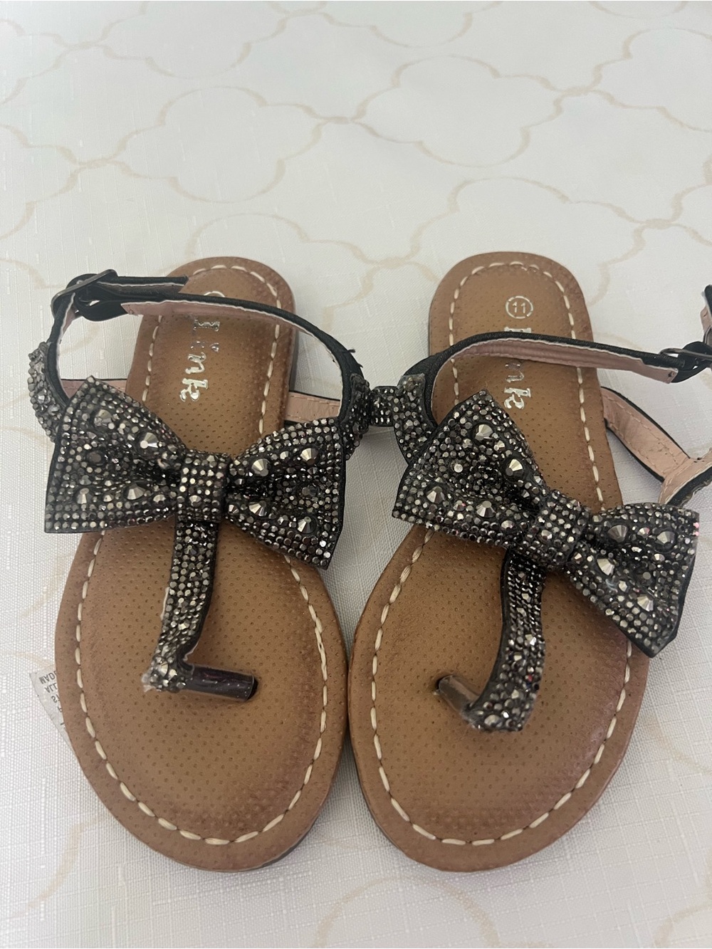 Link Jeweled Bow T-Strap Sandals in Brown and Black